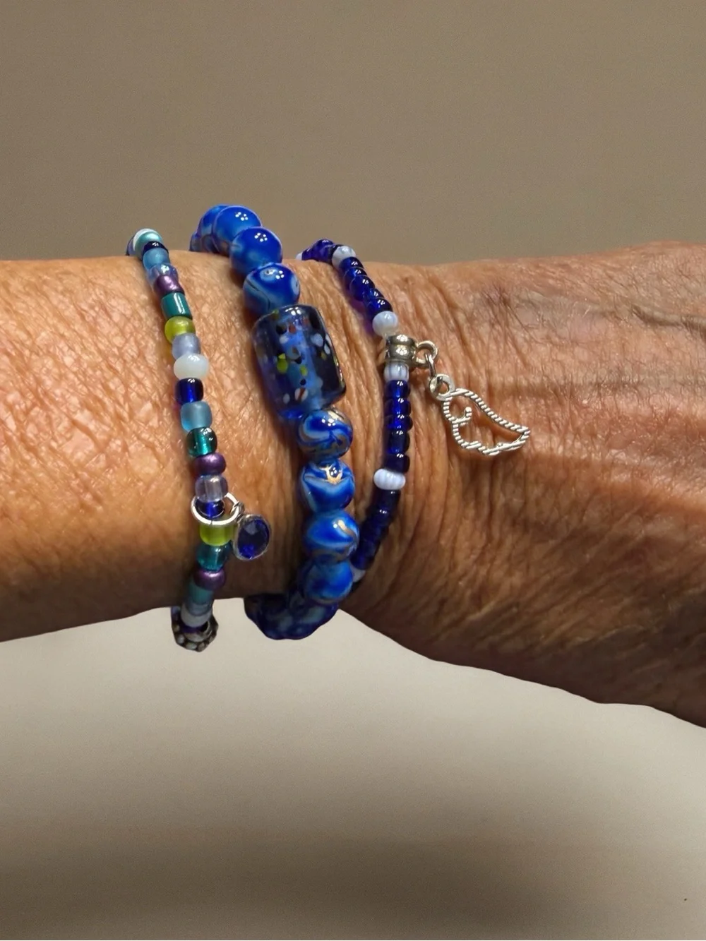 Hand Crafted Blue Glass Bead Trio Bracelet Set with Silver Wing Charm